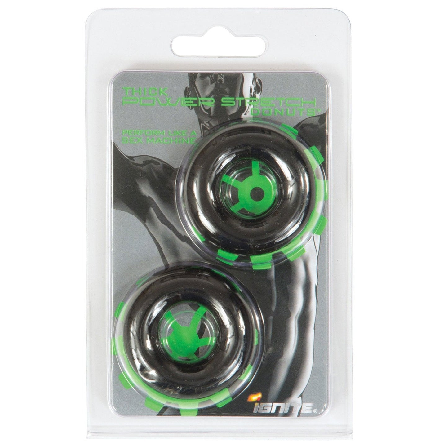 The packaging displays two black and green Ignite Thick Power Stretch Donuts - PKG. of 2 in clear plastic wrap, featuring a muscular figure. Labeled under Si Novelties, these versatile cock rings prominently showcase the name Ignite at the bottom.