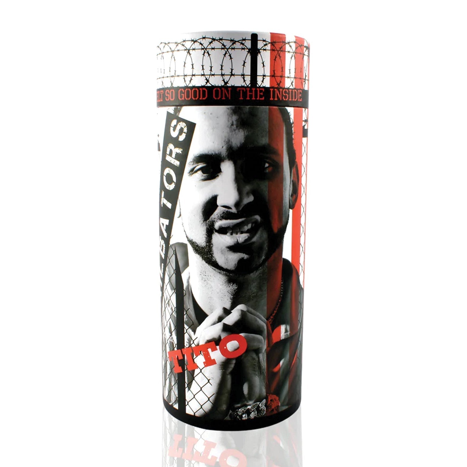 The Jailbators Titos Ass Stroker is a cylindrical container with a ribbed interior, featuring red and black graphics of a person behind barbed wire. It includes the text Tito and So Good on the Inside, highlighting its realistic TPE design.