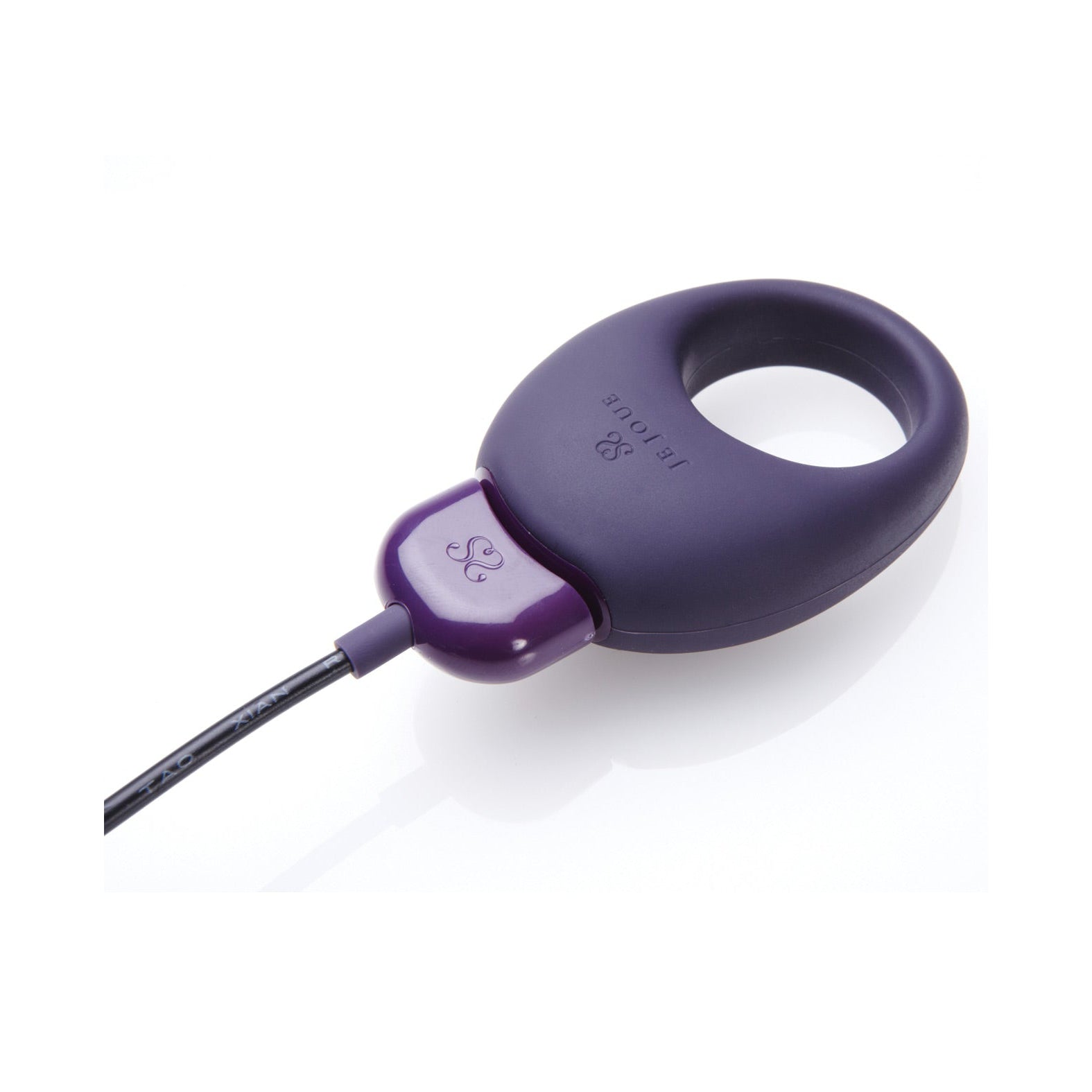 A sleek, purple Je Joue Mio cock ring features a teardrop shape, a circular opening at one end, and a black cable. Its modern design against a white background offers discreet vibrating functions for an enhanced experience.