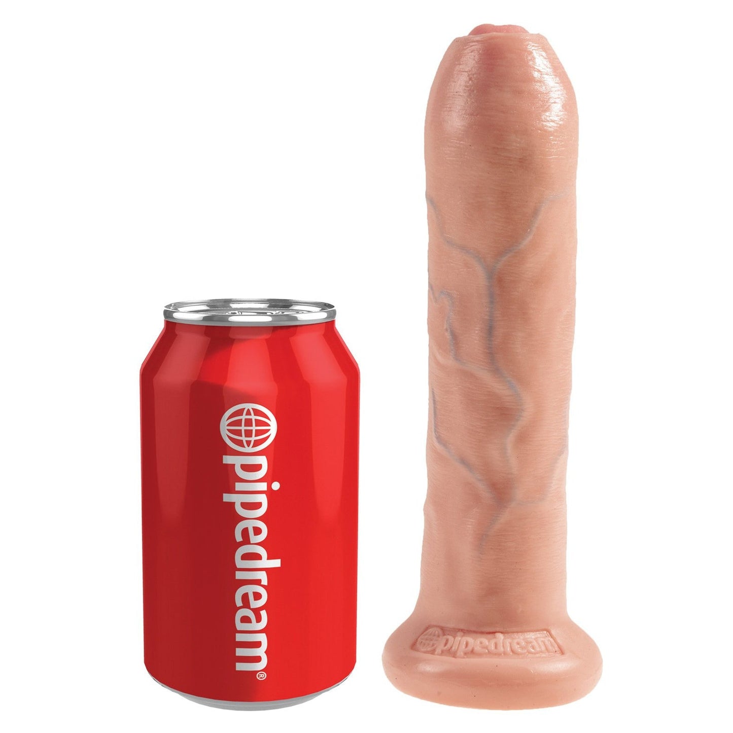 A can of Pipedream soda rests next to a King Cock 7 Uncut Gay Dildo, a large flesh-colored cylindrical object with lifelike veins and a strong suction cup base.