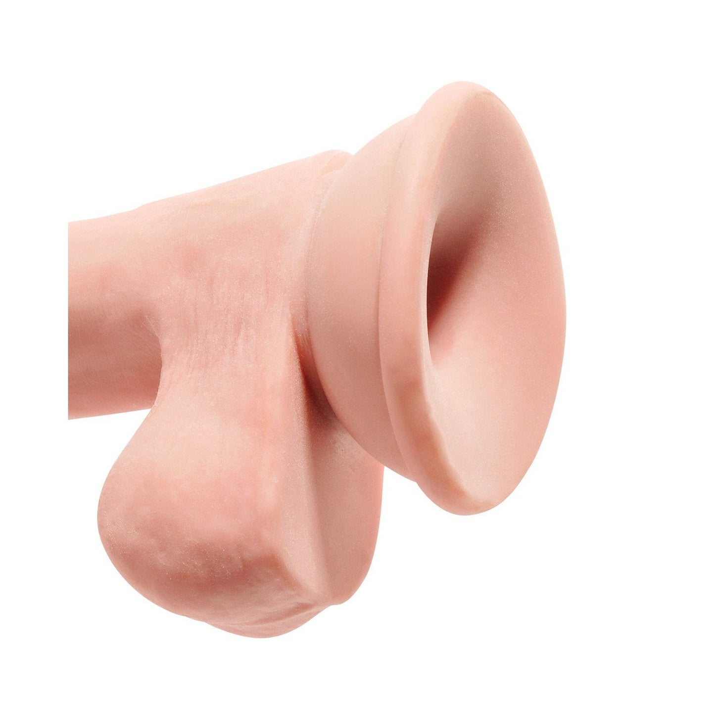 A close-up of the King Cock Plus 6.5 Triple Density Cock with Balls showcases its suction cup base, soft flesh-toned material, and realistic design. Set against a white background, the intricate details of this King Cock product are beautifully highlighted.