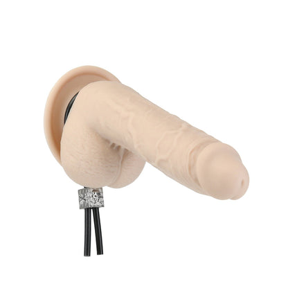 The Lux Active Tether Adjustable Cock Tie by Adams Toy Box is a silicone model of a human appendage with a base, featuring protruding black wires at the bottom. Made from body-safe silicone, it has a textured surface and realistic flesh-toned color.
