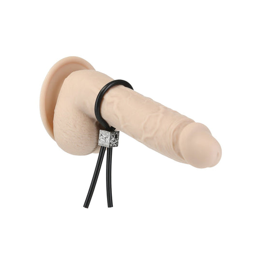 The Lux Active Tether Adjustable Cock Tie by Adams Toy Box is a beige, realistic-looking dildo made from body-safe silicone. It features black straps with a silver square and has a round base for secure suction or attachment, combining versatility and style.