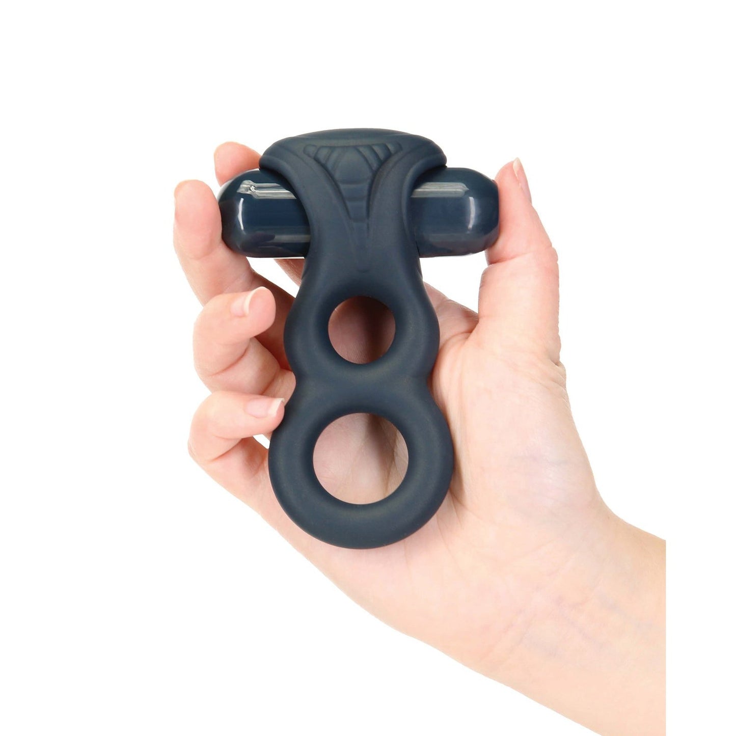 A hand holds the Lux Active Triad, a 4.5 black silicone vibrating dual ring with textured loops and ergonomic design from LUX, perfect for couples play. This sleek accessory possibly includes remote control functionality.