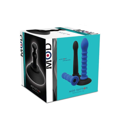 The MOD Suction Cup - Black packaging displays a blue silicone toy with a ribbed design and black suction base for hands-free use. Set against a white and teal background, the product is shown from various angles to highlight its versatile multi-toy compatibility.