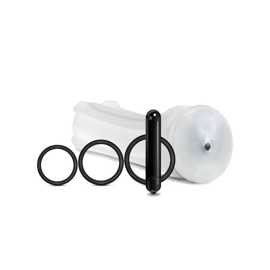 The MSTR B8 Vibrating Stroker Pack Hand Cuff - Kit of 5 features a white silicone attachment with a rounded tip, three customizable black rings in varying sizes, and a sleek black vibrating stroker, all elegantly arranged on a pristine white background to highlight their innovative design and superior materials.