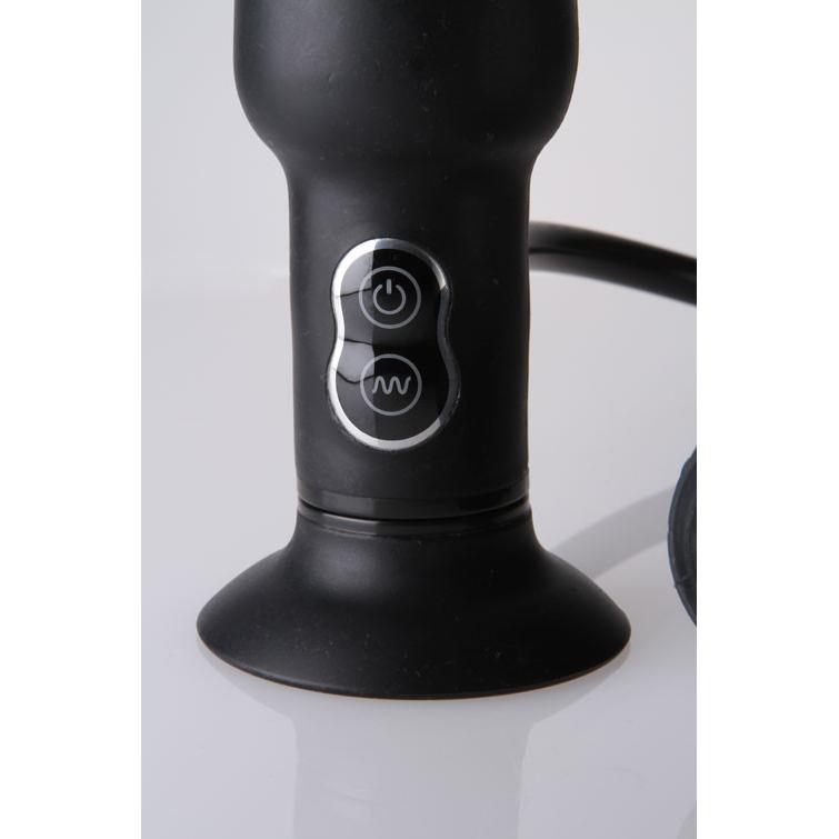 A close-up shows the Malesation Inflatable Butt Plug w/ Vibration, a black silicone device by Malestation. It features a suction base and two control buttons with light accents: one for power and another for adjusting vibrations. The plug is elegantly displayed on a white surface.