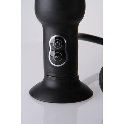 A close-up shows the Malesation Inflatable Butt Plug w/ Vibration, a black silicone device by Malestation. It features a suction base and two control buttons with light accents: one for power and another for adjusting vibrations. The plug is elegantly displayed on a white surface.