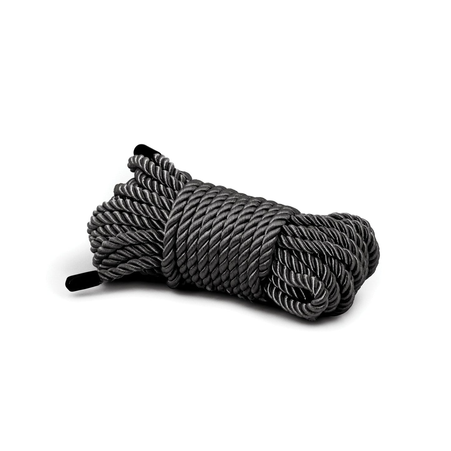A neatly arranged coiled bundle of thick gray Bondage Couture Rope by Bondage Couture, made from high-quality synthetic material, is displayed on a white background, with black ends visible on each side.