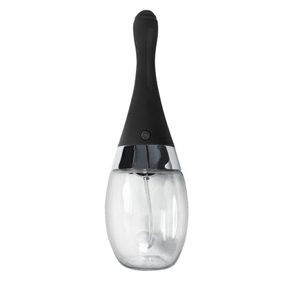 The Electro Douche by Nasstoys is a transparent glass pepper grinder featuring a sleek black handle and a shiny silver band, offering rechargeable convenience and modern sophistication, prominently displayed from the front.