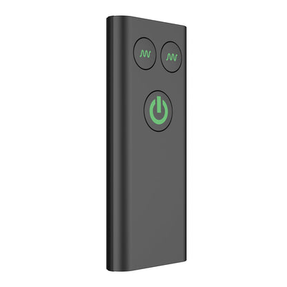 The Nexus Ride, a sleek black remote control for the Nexus Prostate Massager, features two small circular buttons with a green wave symbol and a larger button with a green power icon. Standing upright against a white background, its perfect for discreet operation.