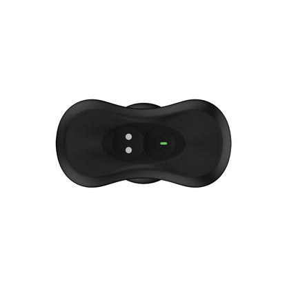 A Nexus Bolster Butt Plug by Nexus features an ergonomically designed remote in black, made of body-safe silicone. It includes two circular buttons at one end and a central green indicator light, showcasing a smooth, curved design on a plain white background.