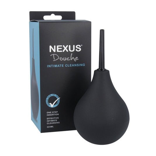 A Nexus Non-Return Valve Anal Douche, with a black pointed nozzle, is displayed next to its packaging. The box shows Nexus Douche and highlights features like One Step Insertion, Effective Intimate Cleaning, and a non-return valve. It has a 224ml capacity.