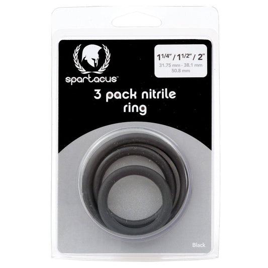 The Spartacus Cock Ring Set Pack of 3 packaging displays three skin-safe black rings in sizes 1-1/4, 1-1/2, and 2 with measurements in inches and millimeters, along with the prominent Spartacus logo.