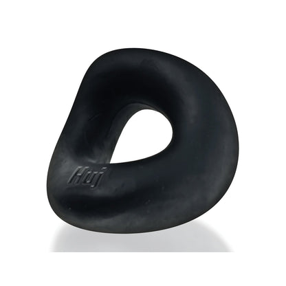 The Hunkyjunk Form Cock Ring by Hunky Junk is a black, stretchy-rubber cockring with an embossed Huj logo. It features a smooth surface with a slightly twisted, asymmetrical shape, shown against a white background.