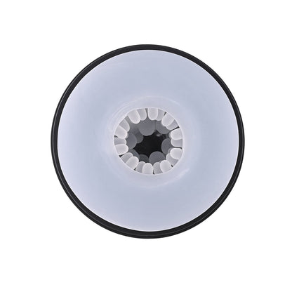 Close-up of the Playboy Pursuit Of Pleasure Stroker - 2 AM, showcasing its gear-like design with a white outer ring and curved center structures hinting at pleasure. Seen from above against a pristine white background, it reflects premium craftsmanship.