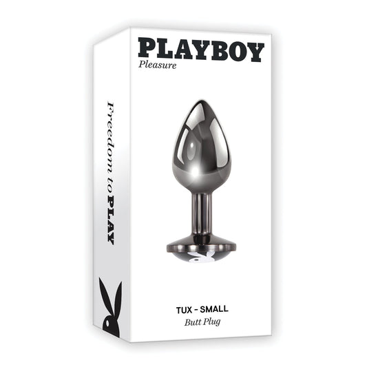 The Playboy Tux Small Butt Plug, made from body-safe aluminum alloy, arrives in sleek packaging featuring a white box with black text and an image of the metallic product. It displays the iconic bunny logo and Freedom to Play on its side.