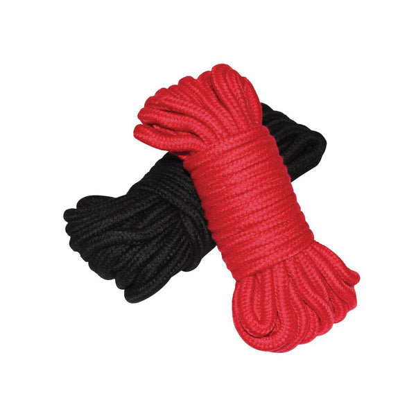 Plesur cotton shibari bondage rope 2-pack: a coiled hank of red braided cotton rope lying across a hank of black braided rope.