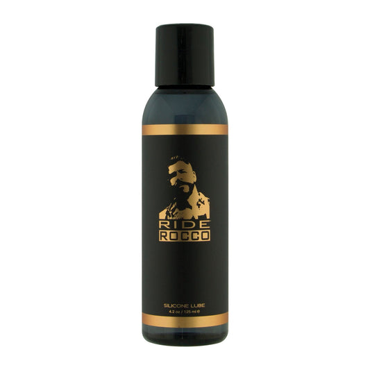 The Ride Rocco Silicone Lube features a stylish black and gold design with a mans silhouette. This durable, long-lasting 4.2 oz (125 ml) waterproof silicone blend ensures optimal performance.