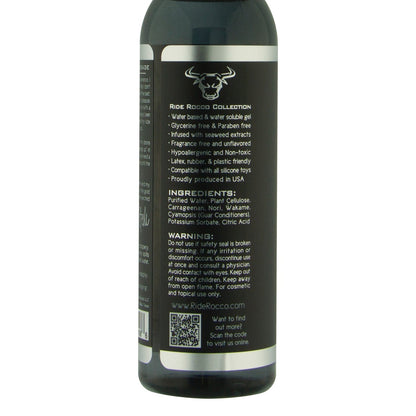 The Ride Rocco Water Based Lube bottle is black with white text and a bull logo, detailing its long-lasting formula and natural seaweed extracts. It features ingredients, a warning, and a QR code; the cylindrical bottle has a white cap.