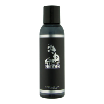 The 4 oz black bottle of Ride Rocco Water Based Lube features a silhouetted figure on the label, contains a long-lasting formula enriched with natural seaweed extracts, and comes with a sleek black cap.