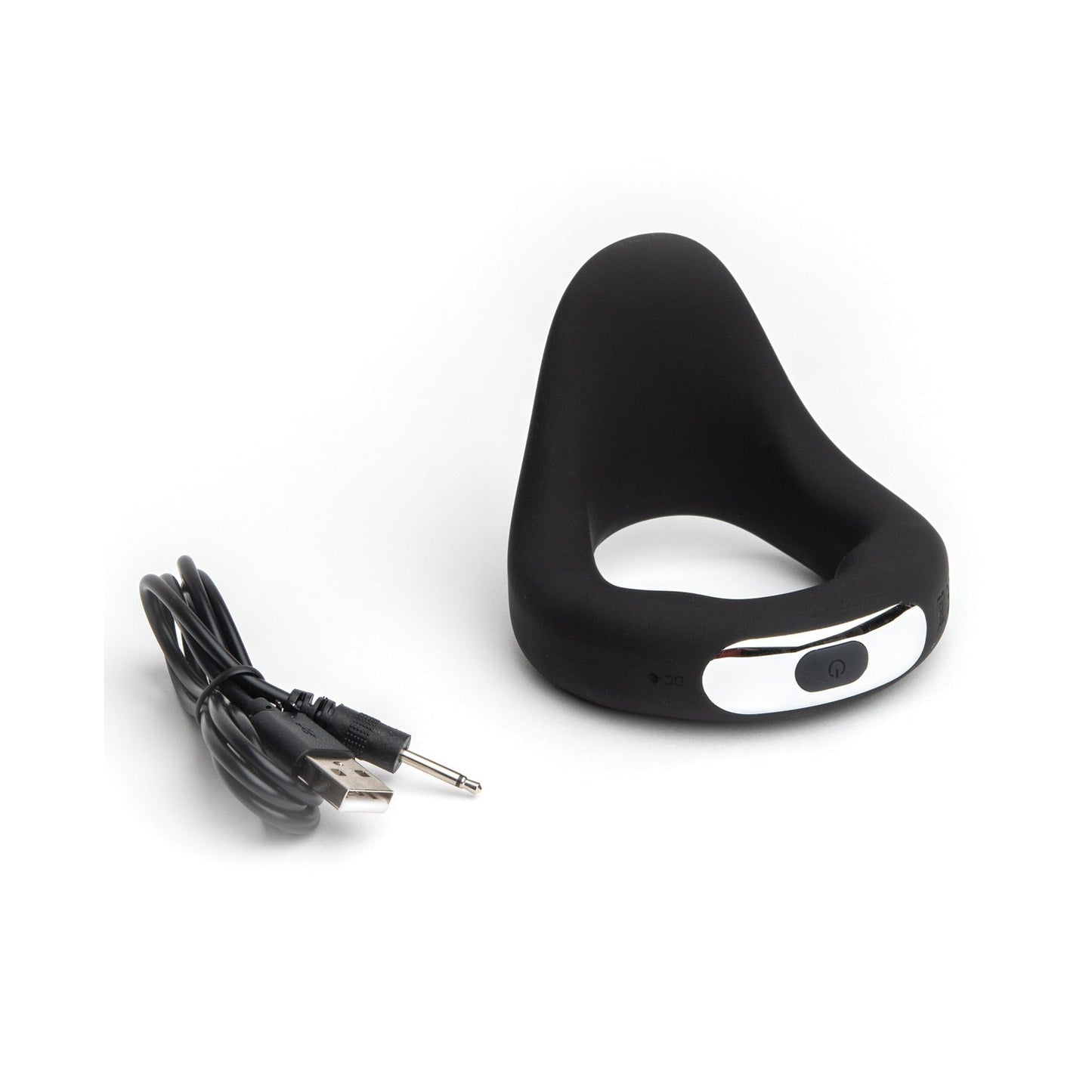 The Sport Fucker Motovibe Apex 48 mm, made of medical-grade silicone, showcases a black ring design with a metallic button. Its presented with a USB charging cable against a white background.