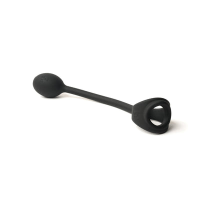 The Sport Fucker Motovibe Buzz Lock, by Sport Fucker, is a premium black silicone holder with one rounded and one looped end, designed for secure paddle transport or storage.