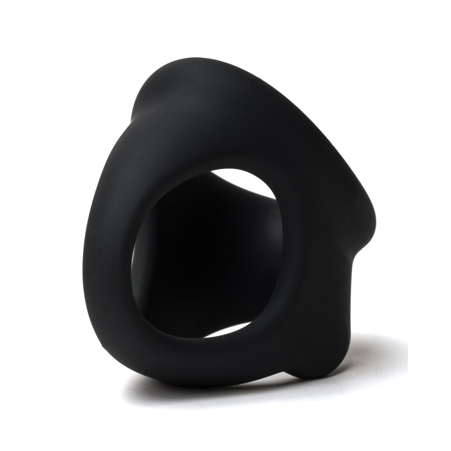 The Sport Fucker Cock Chute by Sport Fucker is a sleek, black sculpture with a hollow circular center and flowing curves, mimicking the smooth design of a silicone toy. Its abstract form rests elegantly on a white background.