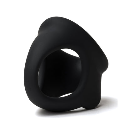 The Sport Fucker Cock Chute by Sport Fucker is a sleek, black sculpture with a hollow circular center and flowing curves, mimicking the smooth design of a silicone toy. Its abstract form rests elegantly on a white background.