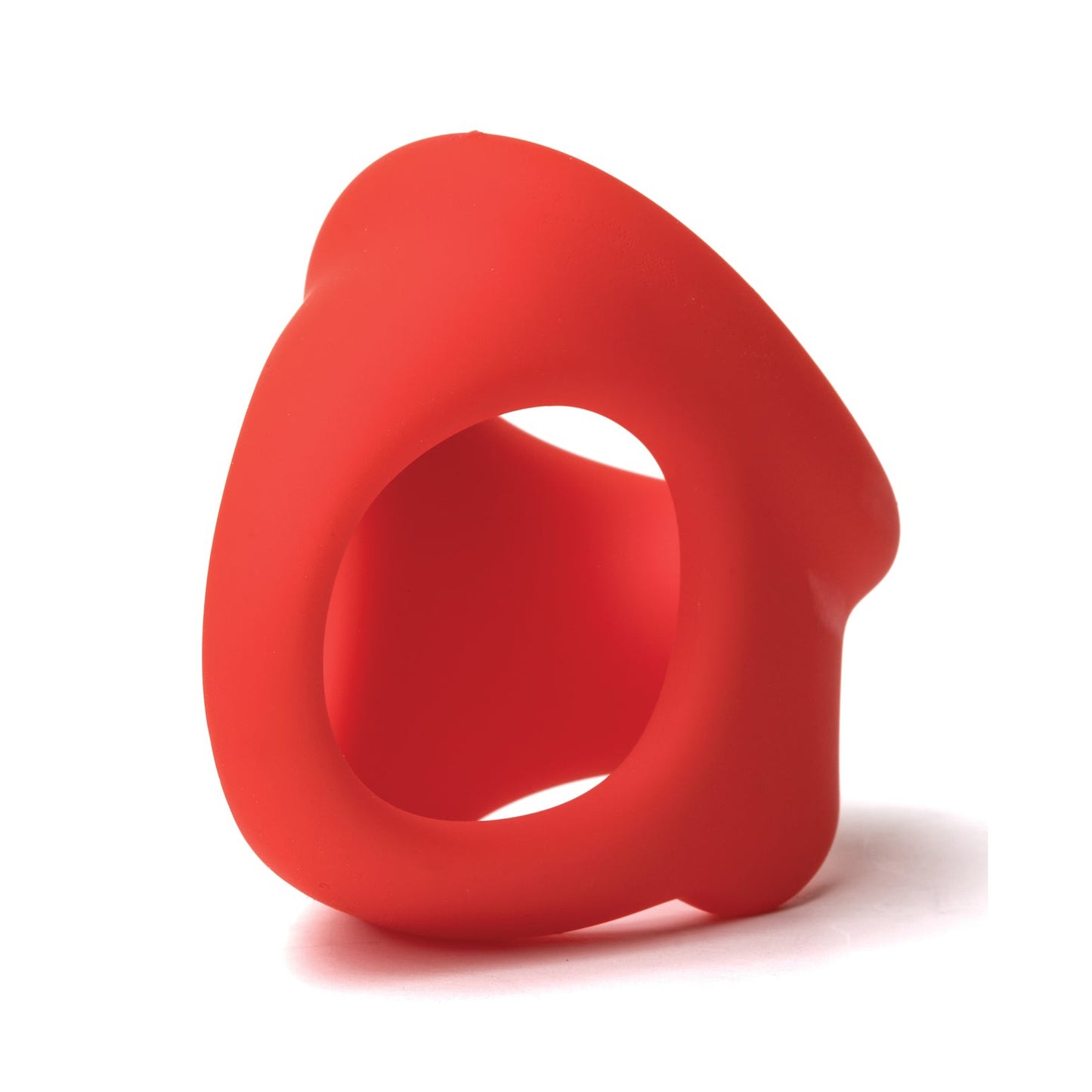 The Sport Fucker Cock Chute by Sport Fucker is a red, abstract silicone toy with smooth, flowing curves and an asymmetrical shape that casts a subtle shadow on a white background.