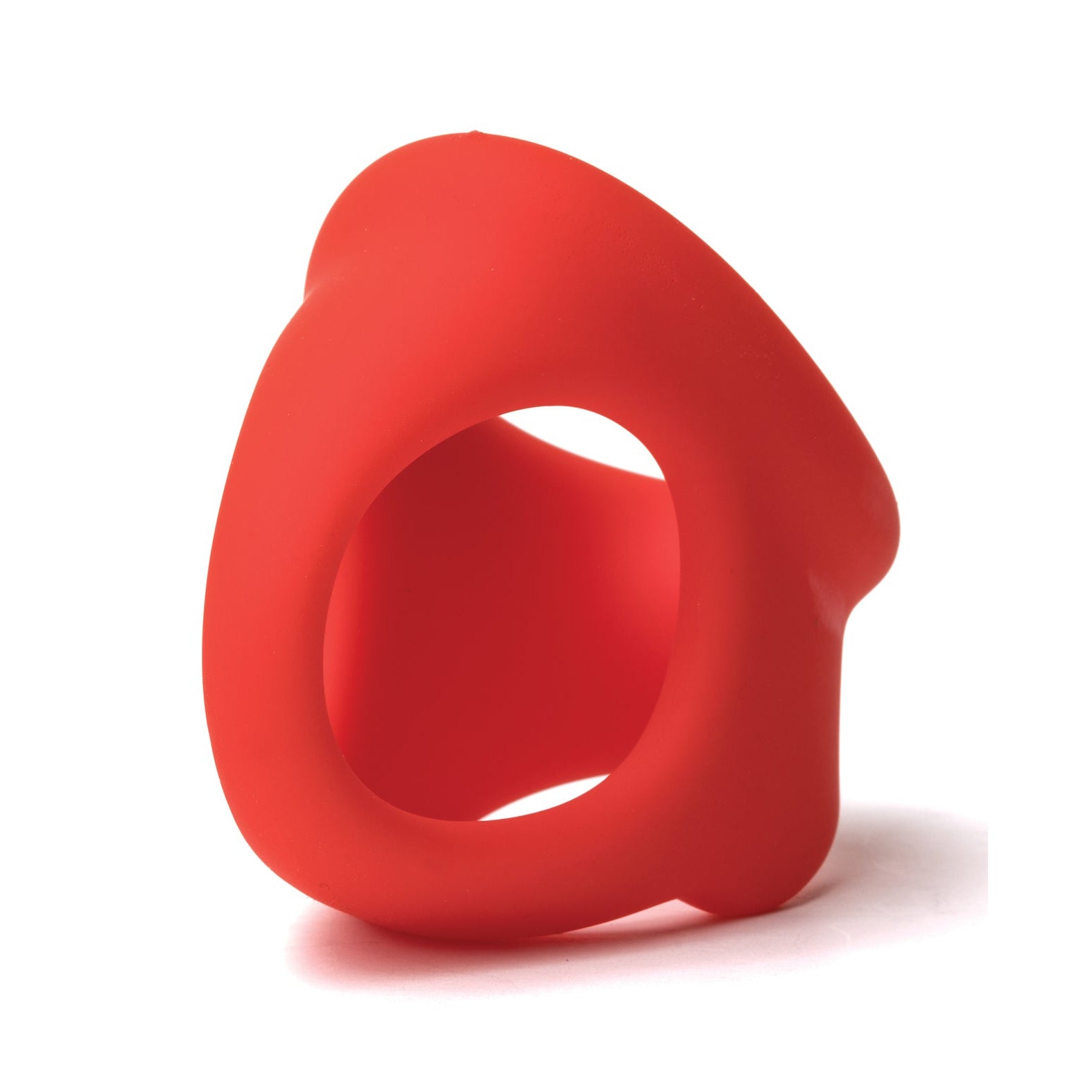The Sport Fucker Cock Chute by Sport Fucker is a red, abstract silicone toy with smooth, flowing curves and an asymmetrical shape that casts a subtle shadow on a white background.