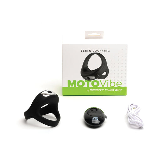 The Sport Fucker Motovibe Sling Cockring With Remote in black from 665 inc is displayed with packaging, a wireless remote, and a white charging cable. The box features MotoVibe by Sport Fucker branding in green and white. Its an IPX7 waterproof device for durability and versatility.