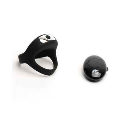 The Sport Fucker Motovibe Sling Cockring With Remote by 665 inc is a black, flexible ring with a silver button next to a small black device featuring a digital display. Both boast waterproof IPX7 technology and are set against a plain white background.
