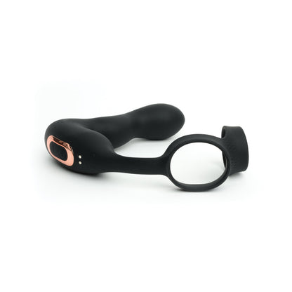 The Sport Fucker Motovibe Magnum Lock is a black and rose gold wearable toy from Sport Fucker, designed for intimate use. It features a curved shape, loop for easy handling, smooth matte finish, and remote control for customizable vibration modes.