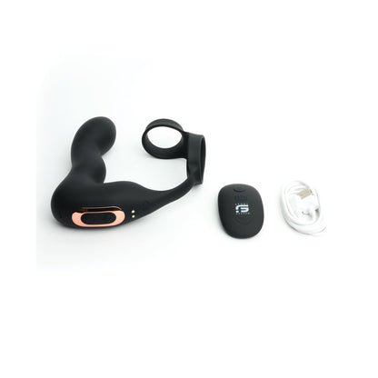 The Sport Fucker Motovibe Magnum Lock, a black curved prostate massager with versatile vibration modes, comes with a wireless remote control and USB charging cable, set against a white background.