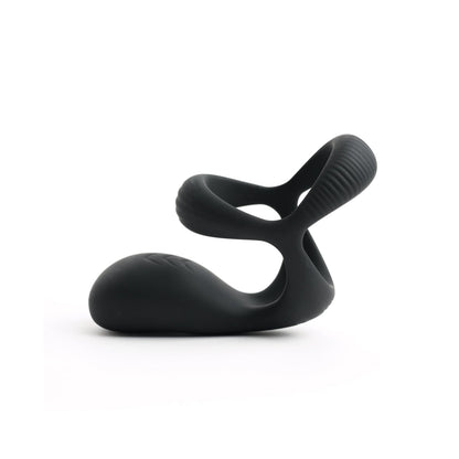 The Sport Fucker Motovibe Pulse Cockring by Sport Fucker showcases a sleek, modern design in black silicone. Its smooth, curved shape with textured loops is reminiscent of abstract art and offers functionality with a water-resistant feature, all set against a white background.