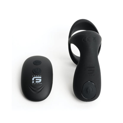 The Sport Fucker Motovibe Pulse Cockring, featuring a sleek black wireless remote with an on/off button and circular band, sits against a white background. Its water-resistant design makes it ideal for sports or fitness enthusiasts.
