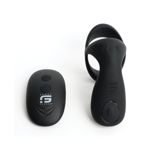 The Sport Fucker Motovibe Pulse Cockring, featuring a sleek black wireless remote with an on/off button and circular band, sits against a white background. Its water-resistant design makes it ideal for sports or fitness enthusiasts.