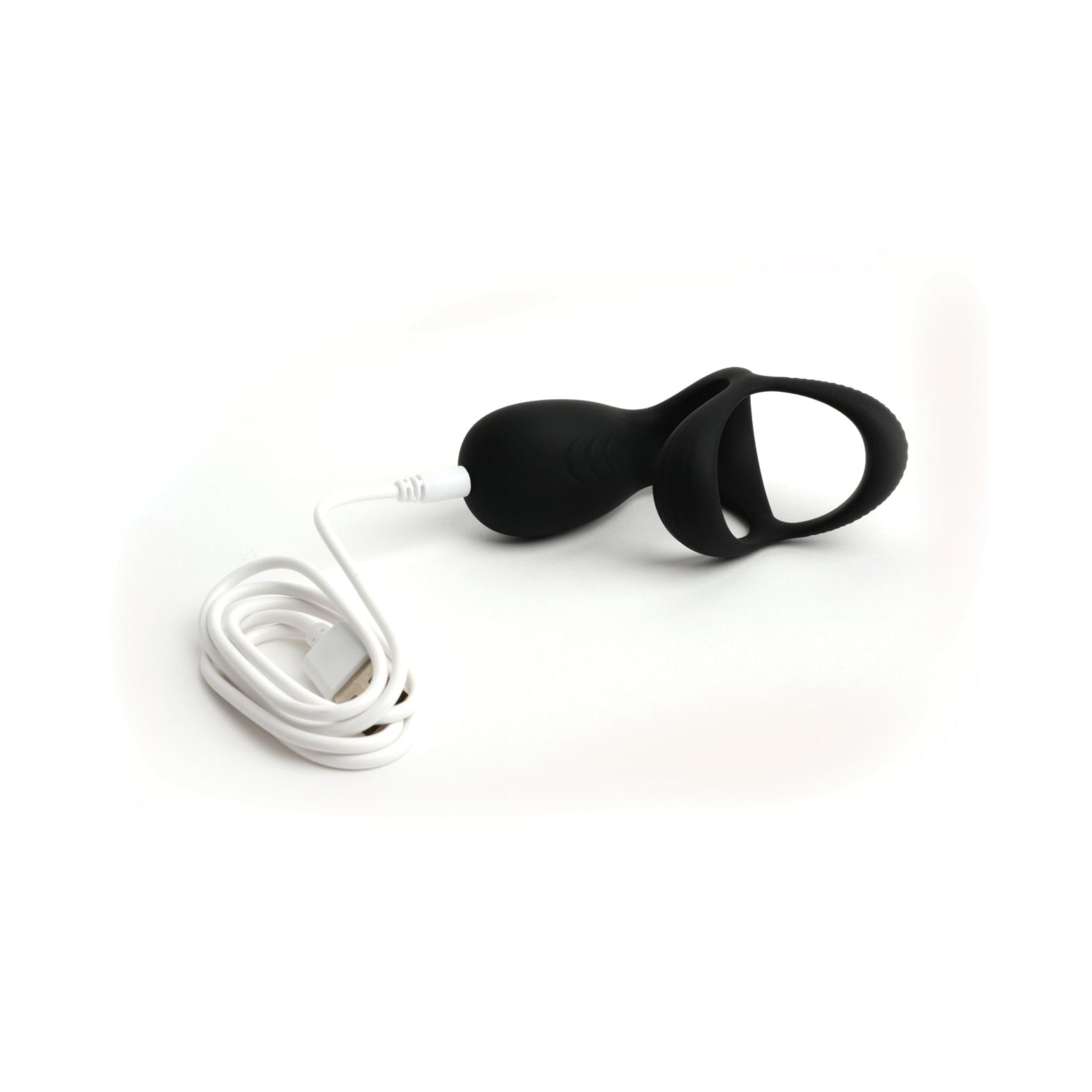 The Sport Fucker Motovibe Pulse Cockring, a black vibrating silicone device with dual loops, is shown connected to a white USB charging cable on a white background.
