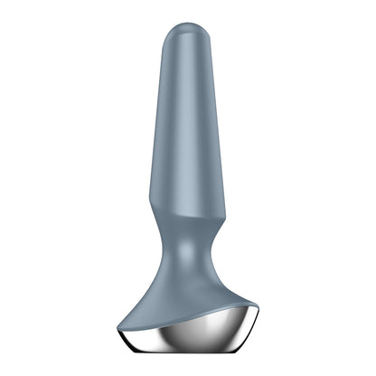 The Satisfyer Plug-ilicious 2 is a silvery-gray silicone butt plug, featuring a tapered shape with a smooth surface and rounded base. It stands upright against a white background and is app-controlled for an elevated sensory experience.