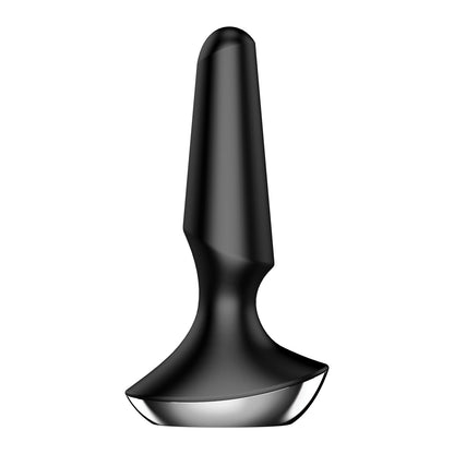 The Satisfyer Plug-ilicious 2 by Satisfyer is an app-controlled device with a sleek black and silver design, featuring a tapered, conical top and rounded base, reminiscent of a modern minimalist sculpture.