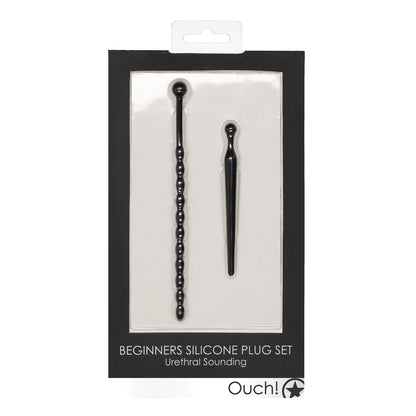 The Shots Ouch Urethral Sounding Beginners Silicone Plug Set by Adams Toy Box includes two black silicone plugs for beginners.
