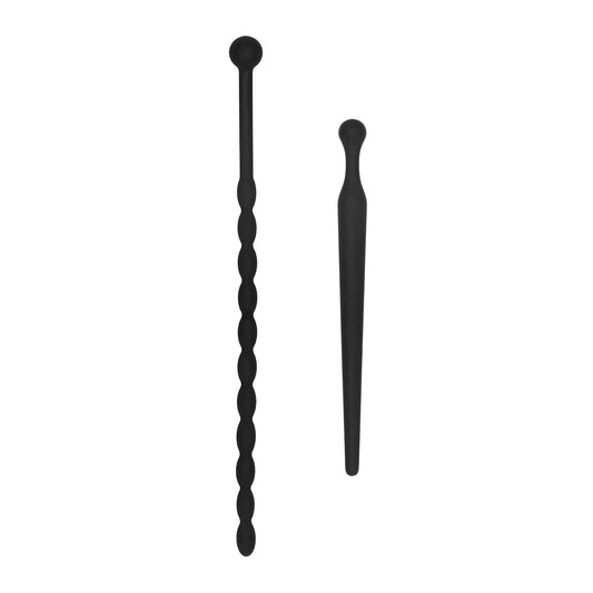 The Shots Ouch Urethral Sounding Beginners Silicone Plug Set by Adams Toy Box features two black silicone tools: one with a smooth cylindrical tip and twisted handle, the other with a tapered end and bulb-like grip, stylishly displayed on a plain white background.