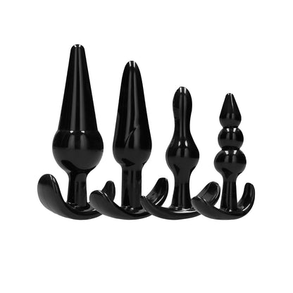 The Shots Sono No. 8 Butt Plug Set by Shots Sono offers four black silicone plugs perfect for beginners exploring anal play, featuring various shapes and sizes with tapered and beaded designs. Displayed against a white background, they provide a sleek introduction to new sensations.
