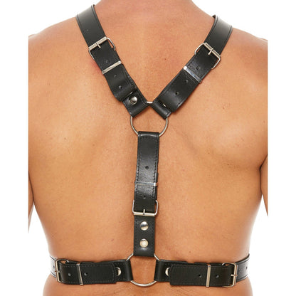 A person is seen from the back wearing the Shots Uomo Mens Harness with Metal Bit by Shots Ouch. The black harness features metal rings and adjustable straps, forming an X shape across the shoulders and fastening securely around the chest, showcasing intricate bondage accessory design.