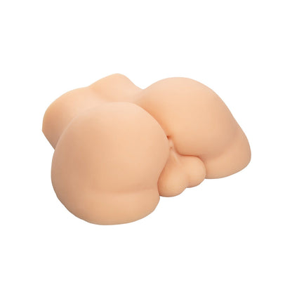 The Stroke It Bottom Banger by California Exotic Novelties is a skin-toned, silicone adult toy made from Pure Skin® material, showcasing a realistic anatomical design. Pictured on a white background, it emphasizes its contours and smooth texture.