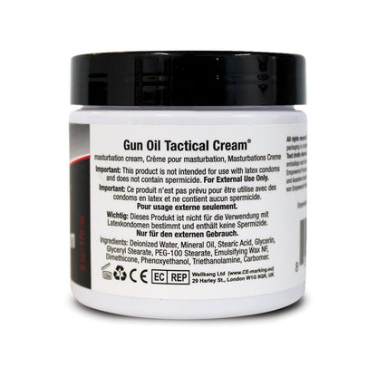 A white container labeled Tactical Cream by Gun Oil, designed for masturbation with a silicone-based formula. It warns against use with latex condoms and is for external use only, with multilingual instructions.