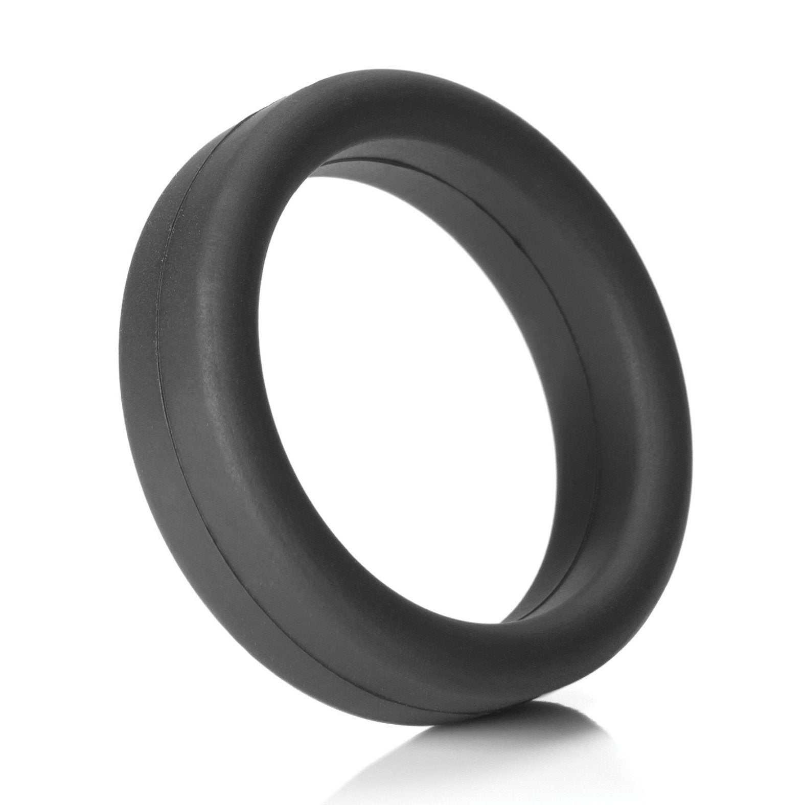 A black silicone Tantus 1.5 Supersoft C Ring is showcased on a white background, featuring a smooth surface and classic design. Positioned upright with a slight shadow beneath, it embodies comfort and elegance.