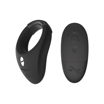 The We-Vibe Bond is a sleek black silicone vibrating cock ring with a matching remote control. Both are crafted from body-safe materials, featuring buttons for power, intensity, and mode selection for your peace of mind.