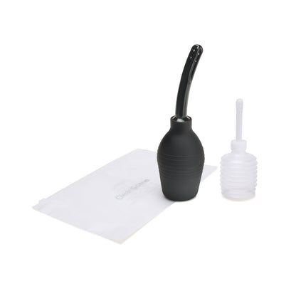 The CleanScene 4 Pc Medical Grade Douche Set includes a black rubber bulb syringe with a curved nozzle, a small clear plastic bottle with a straight nozzle, and a white storage bag, making it perfect for travel.